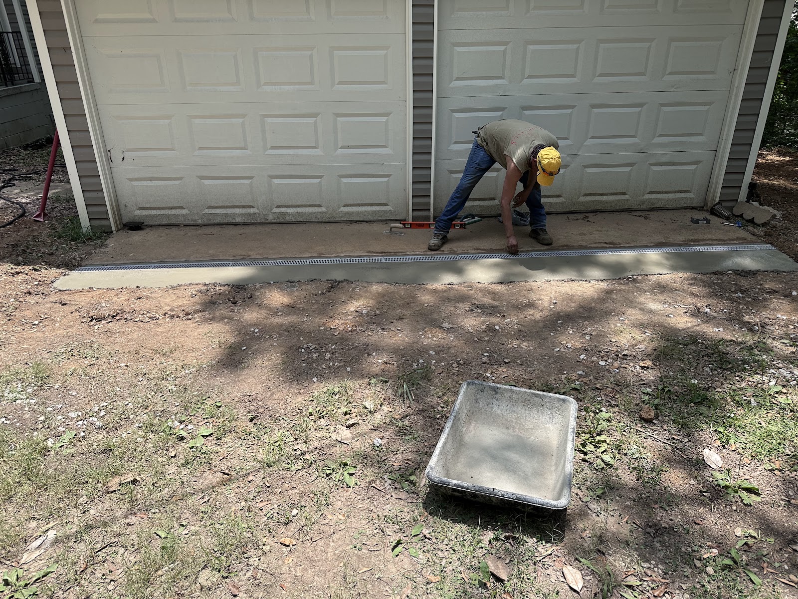 Installing a channel drain along a driveway edge