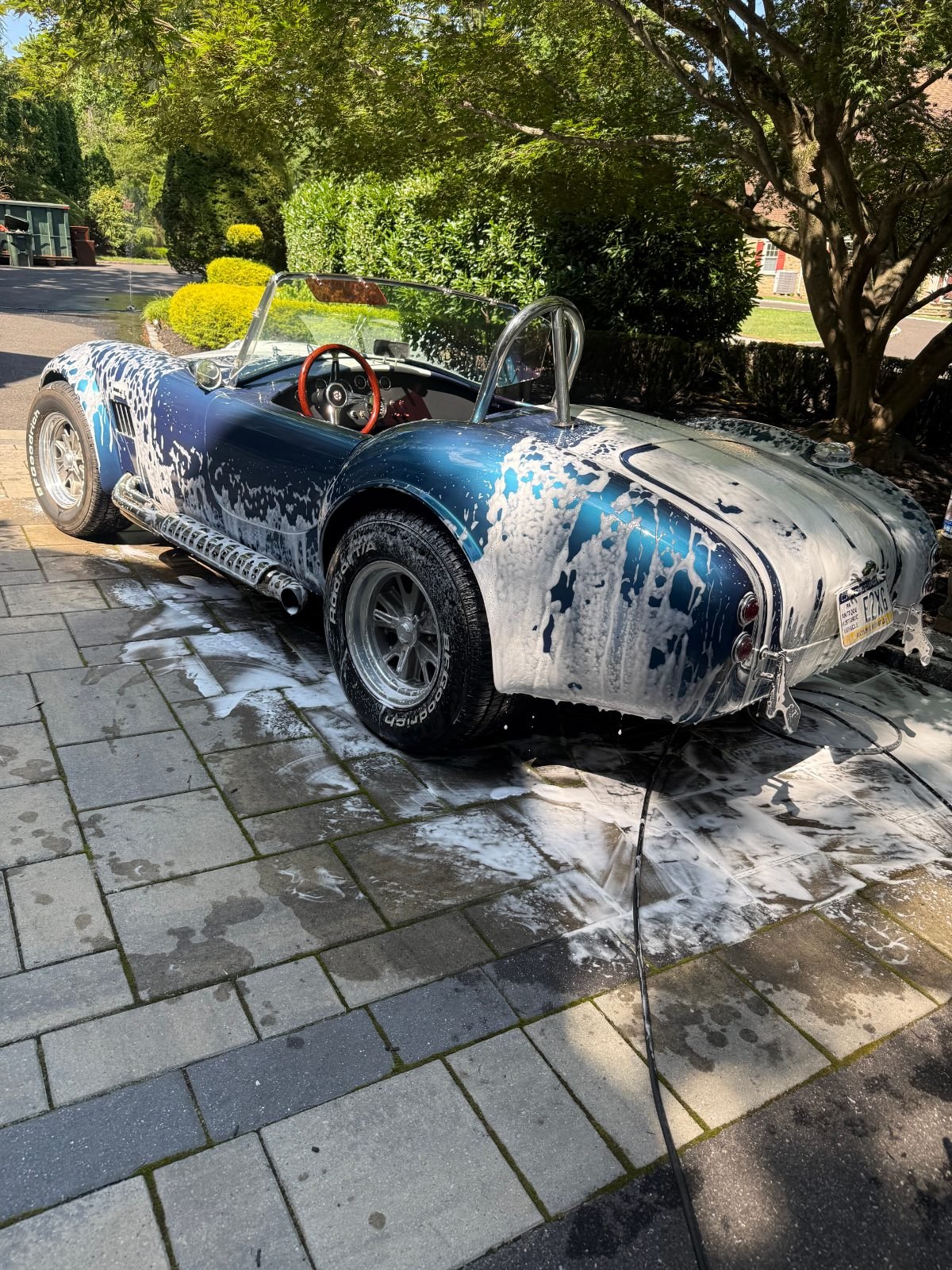 Thick foam covering a Shelby Cobra, rear three-quarter
