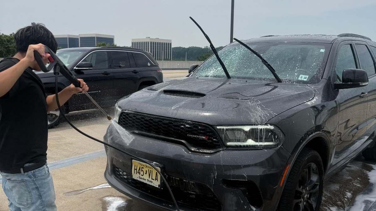 ACBrise washing a Dodge Durango on site at a customer workplace