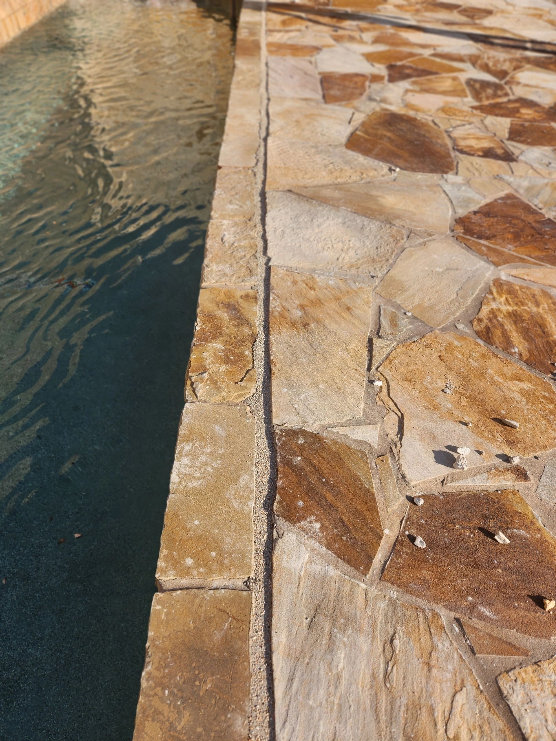 Freshly sealed pool expansion joint