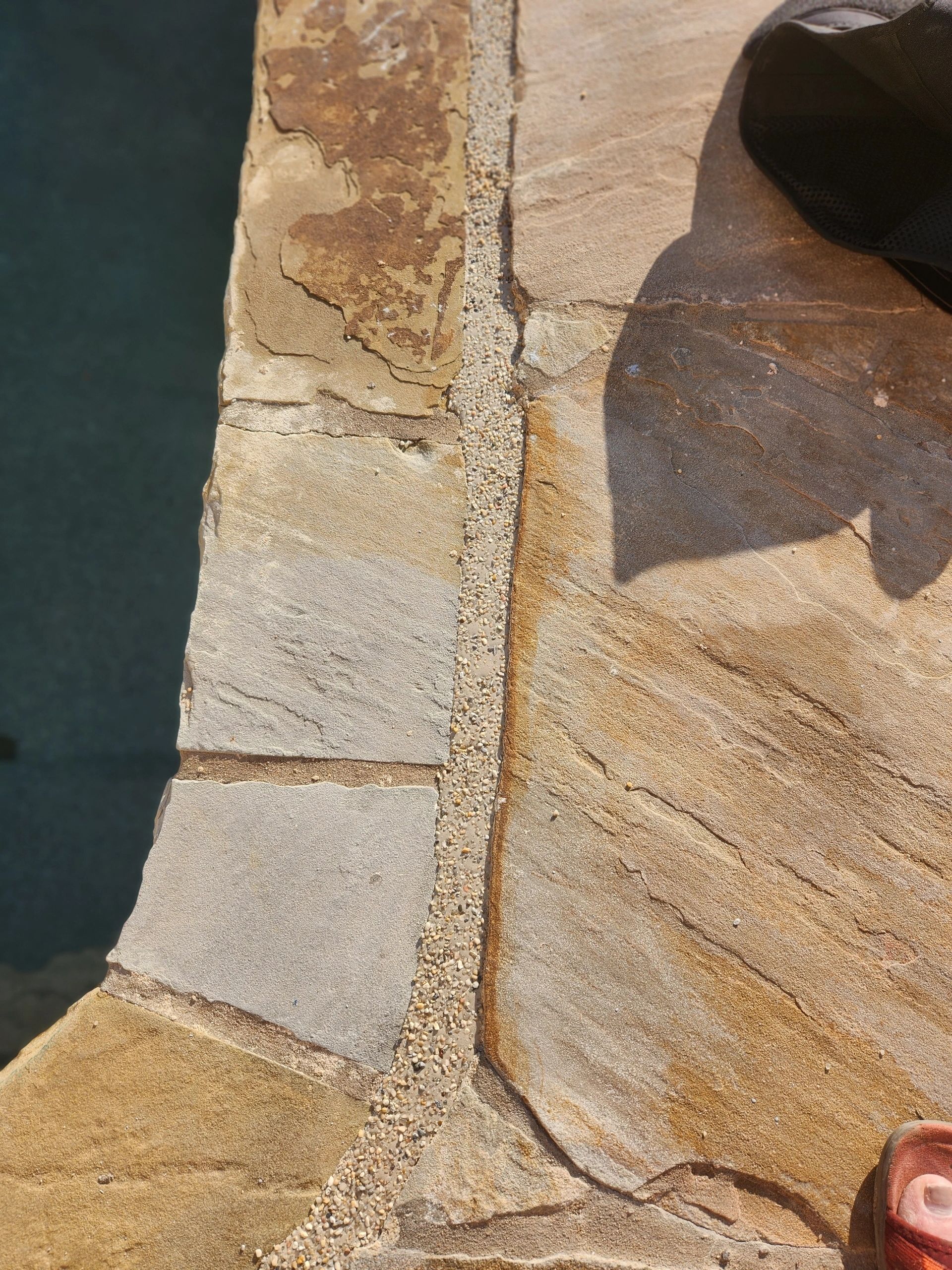 Decorative topping detail on a pool deck joint