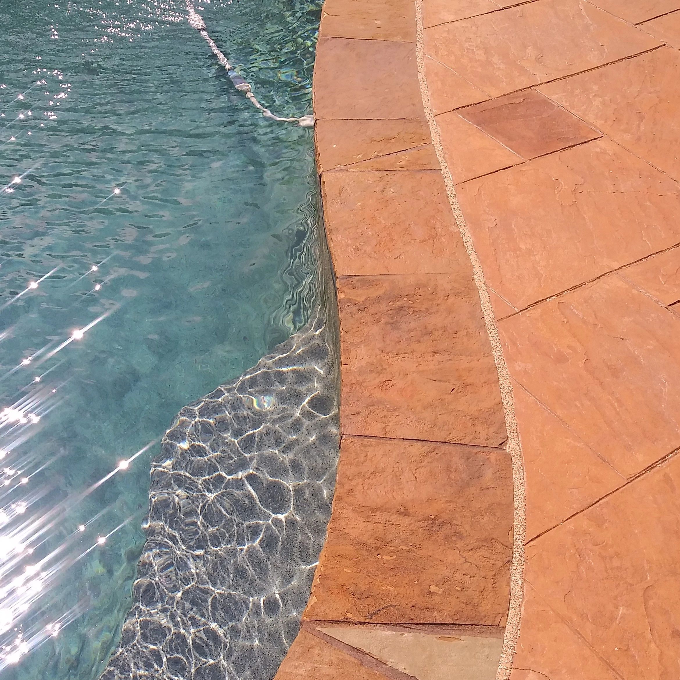 Sealed pool-edge joint close up