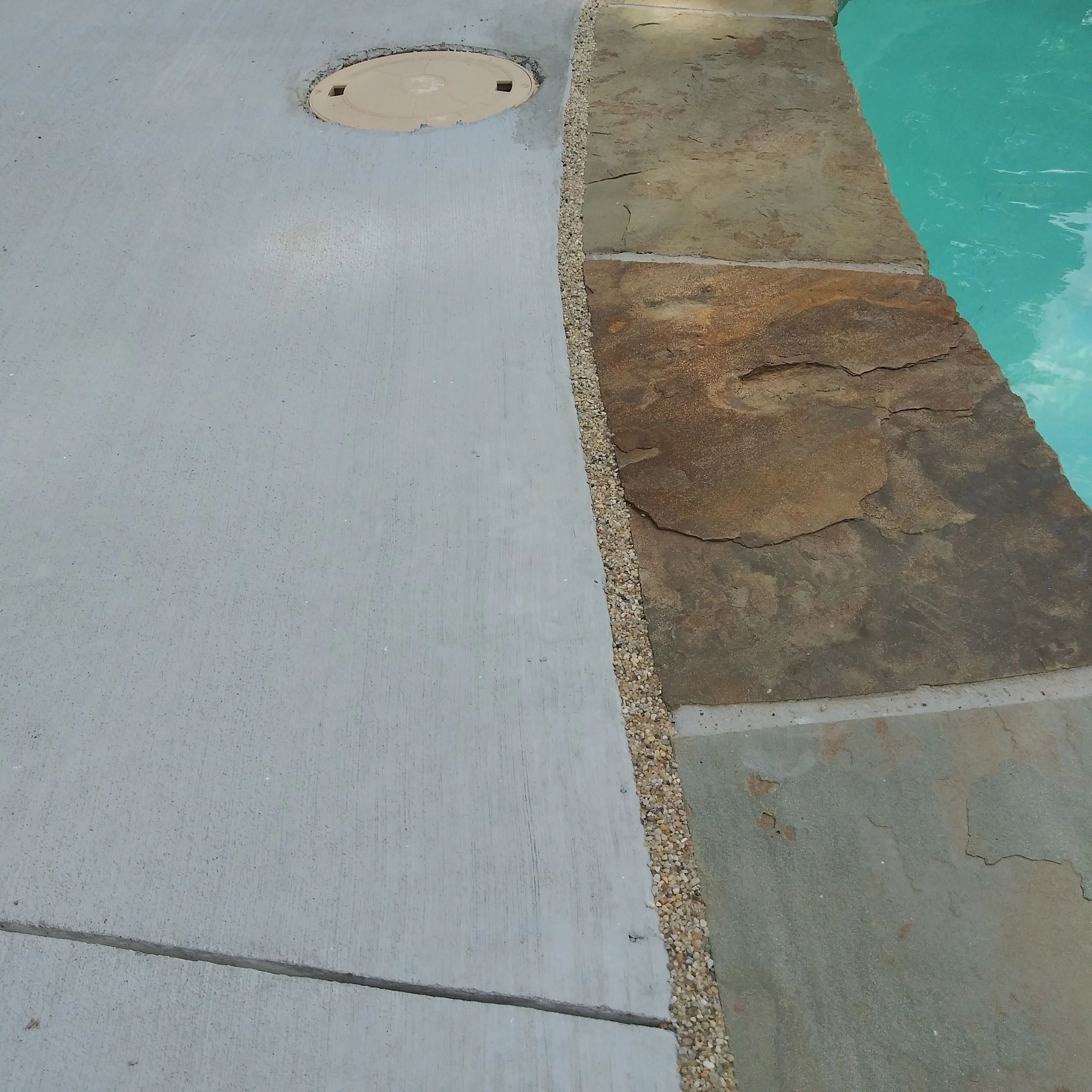 Freshly sealed pool expansion joint with decorative topping