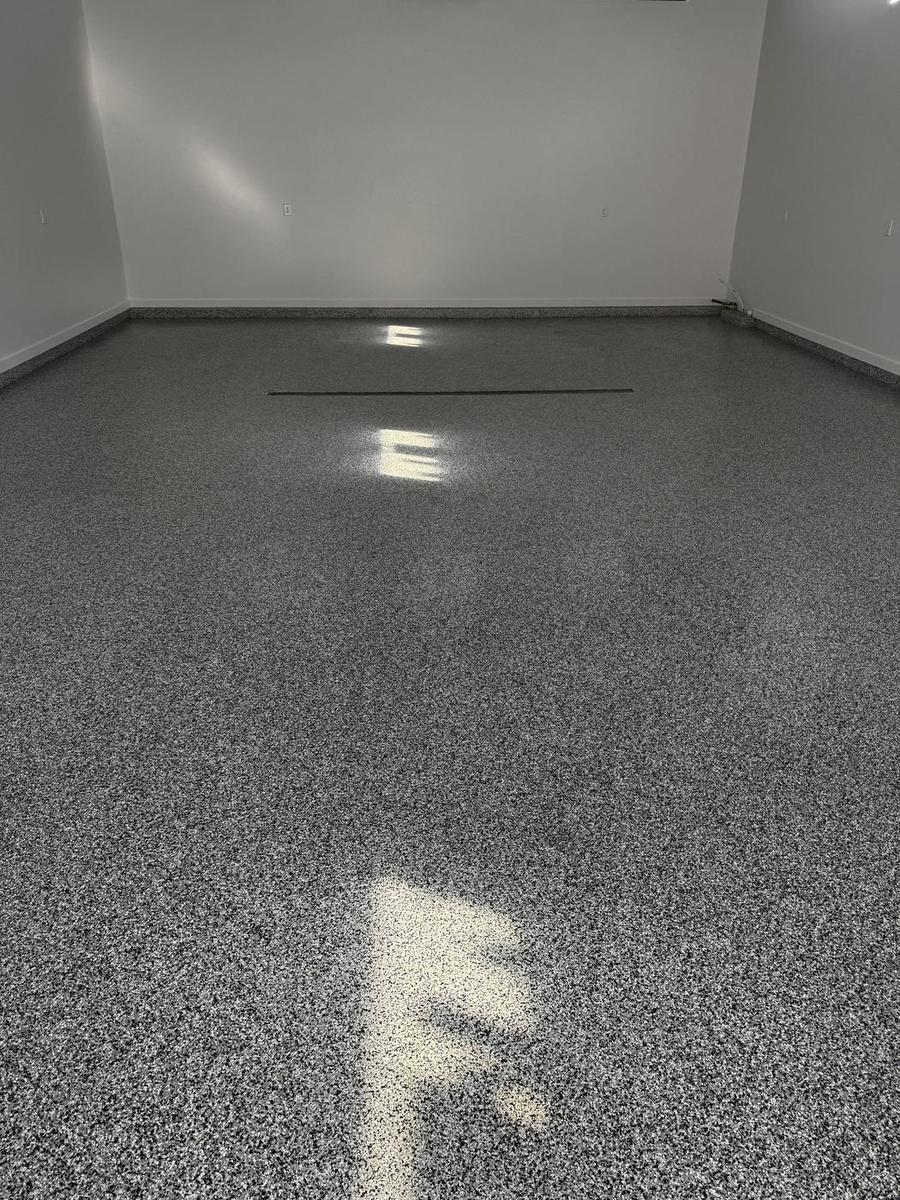 Finished flake floor coating in a bright, empty room