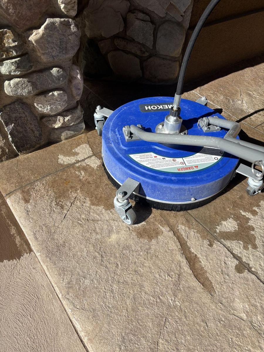 Surface cleaning a stamped patio before topical sealing