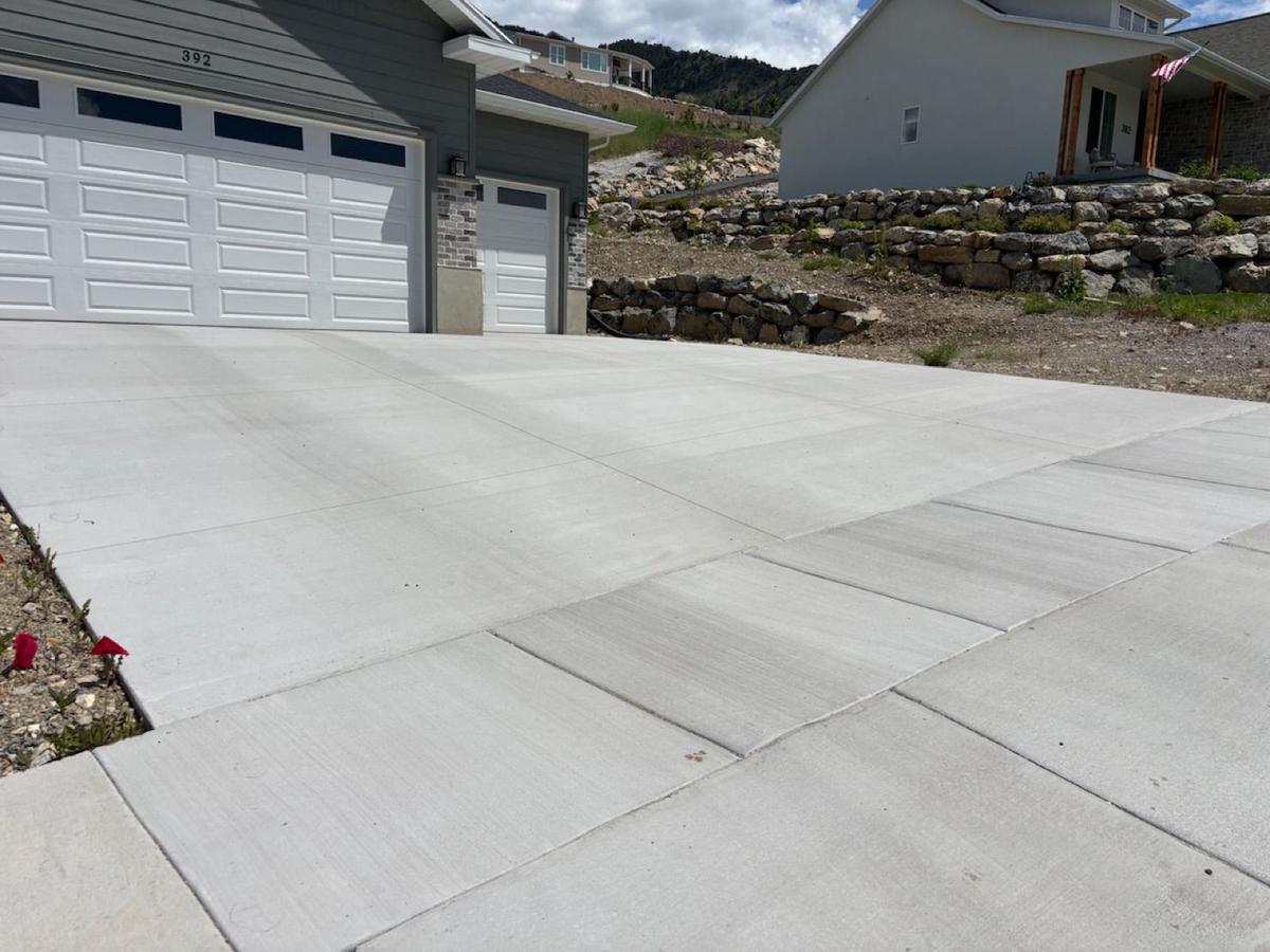 Driveway with tire stains before penetrating concrete sealing