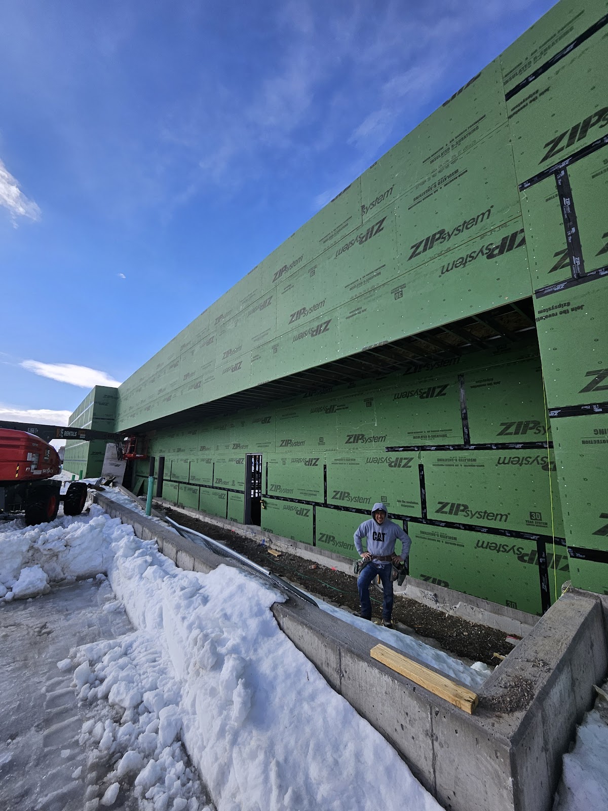 Bozeman Drywall crew on an exterior job site in winter