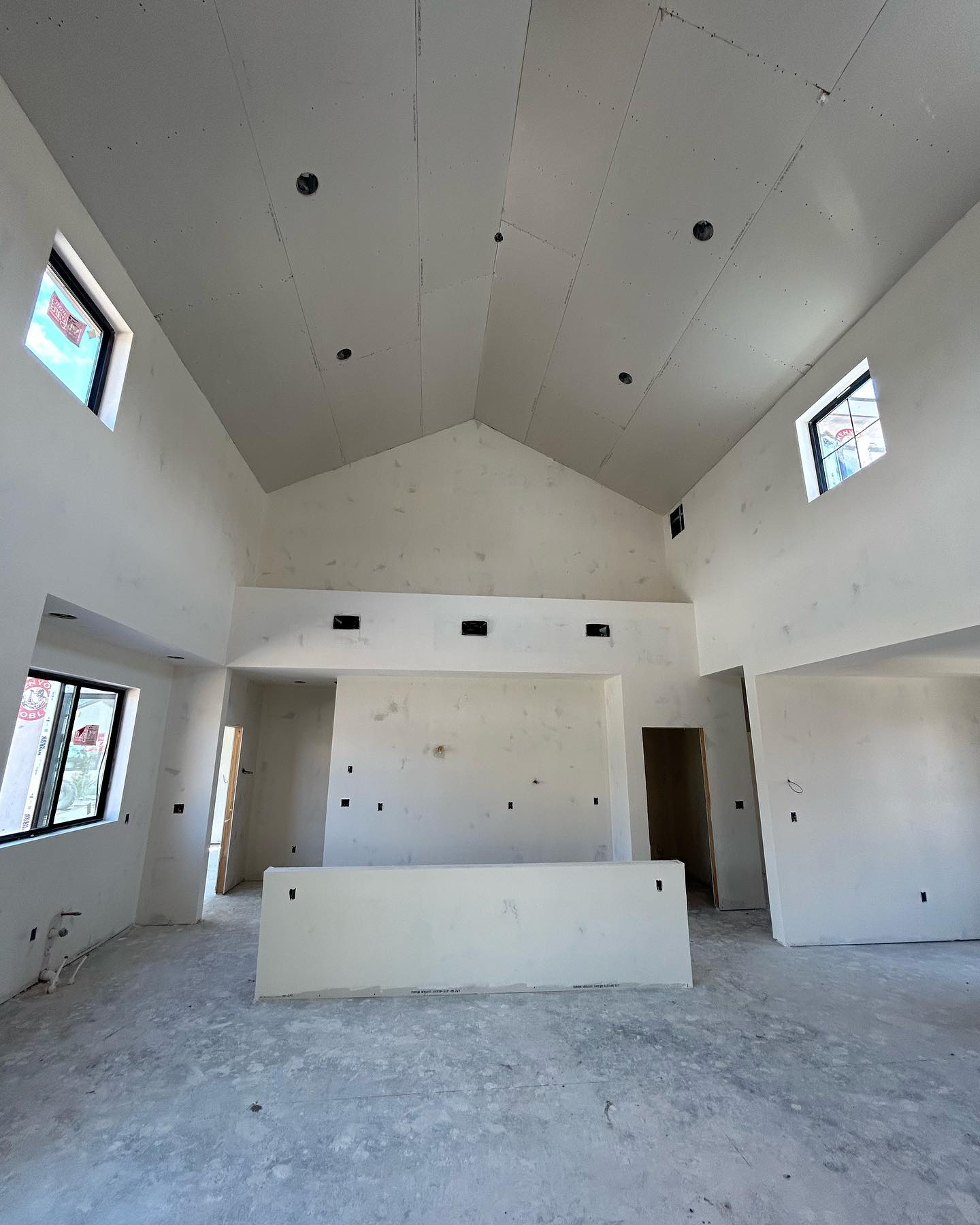 Bozeman Drywall crew hanging drywall on a new Montana build