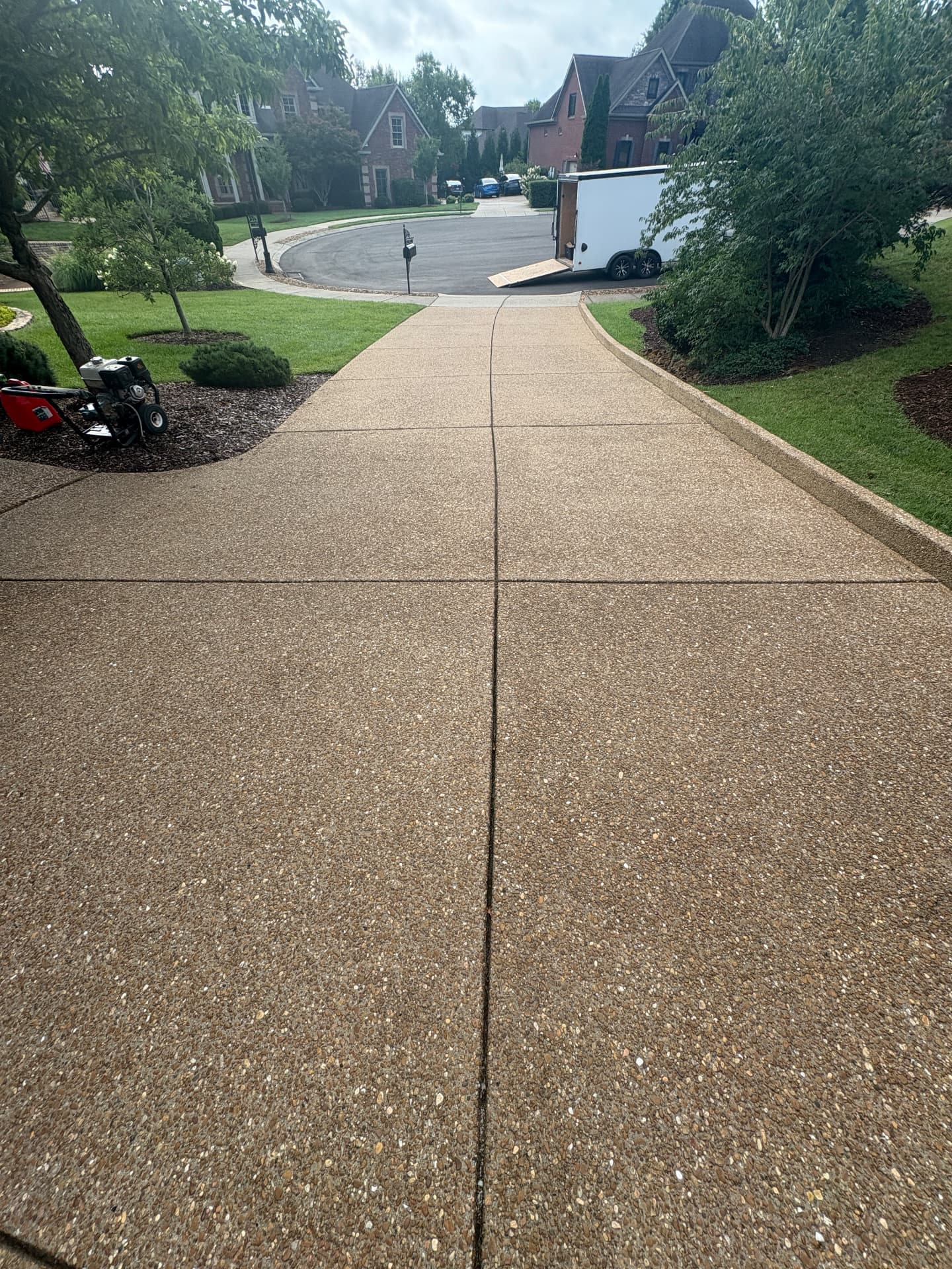 Unsealed concrete driveway before treatment