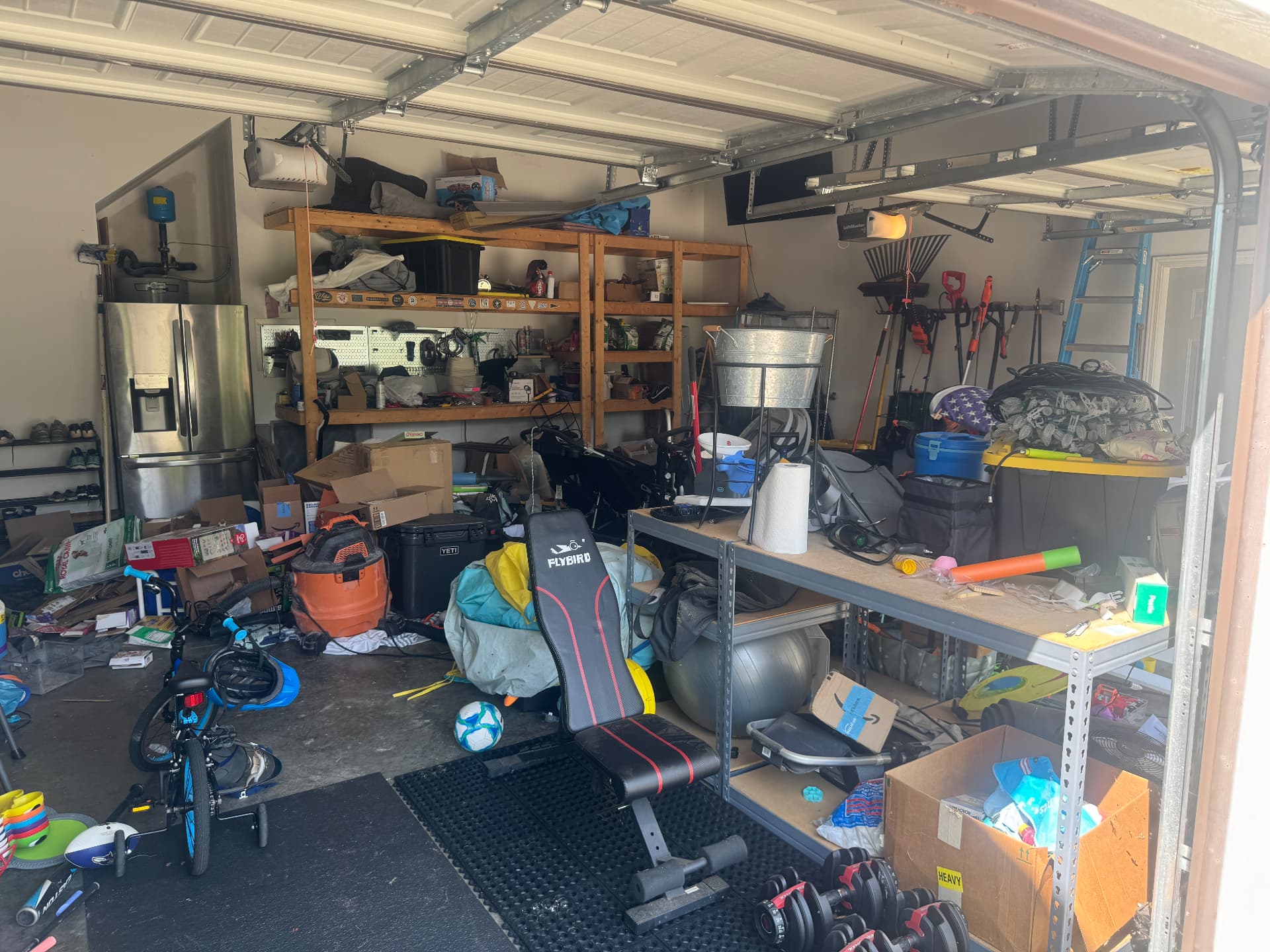 Cluttered garage before organization