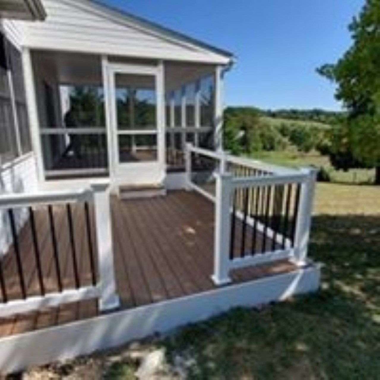 Screened porch and deck addition built by Deck It Out, LLC