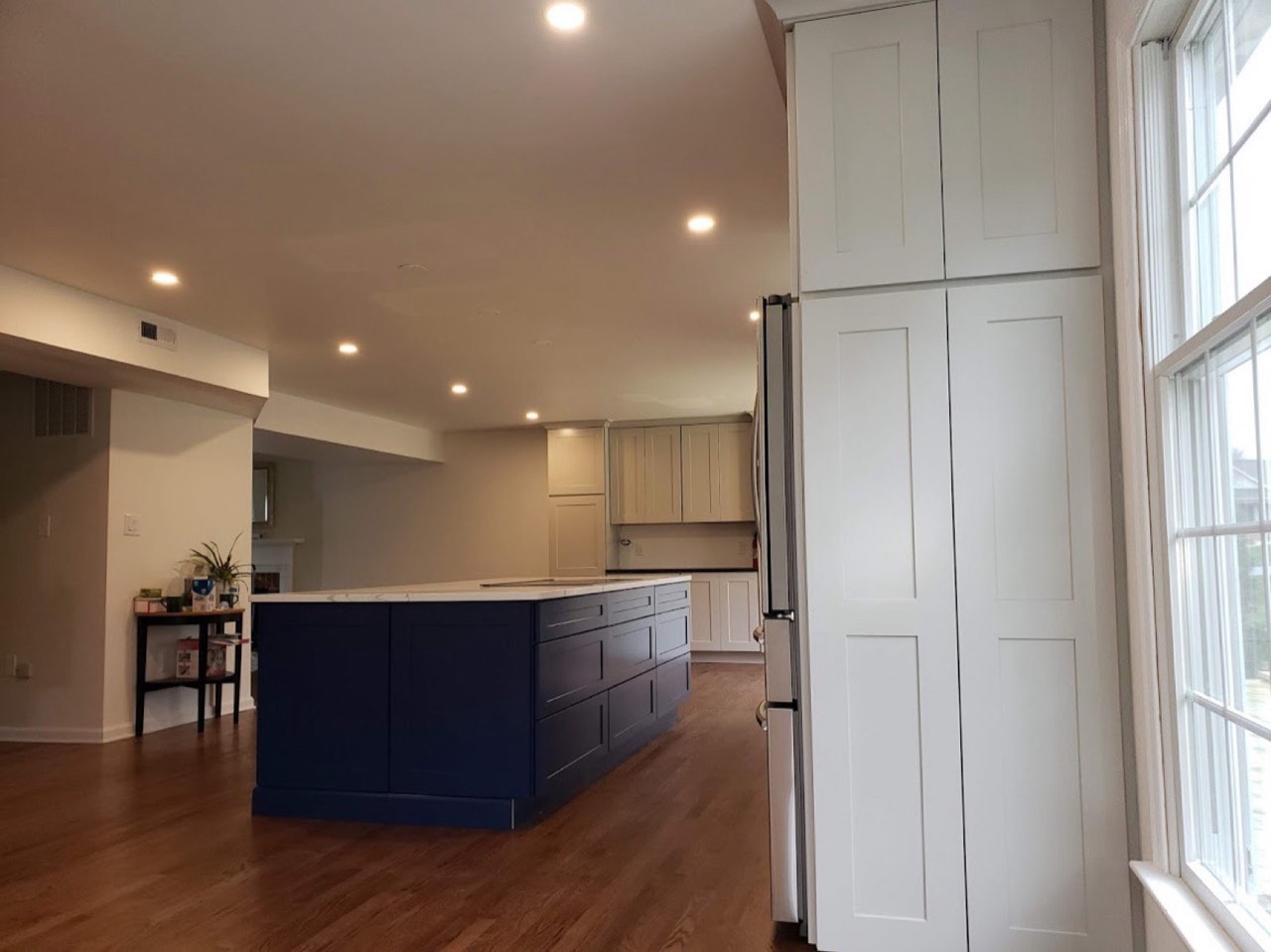 Custom kitchen remodel with navy island by Deck It Out, LLC