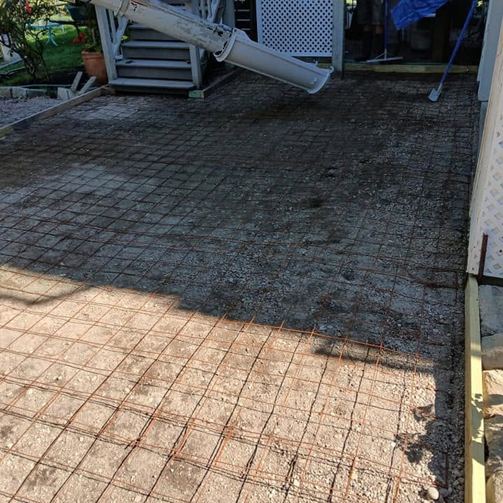 Concrete being placed for a backyard patio slab
