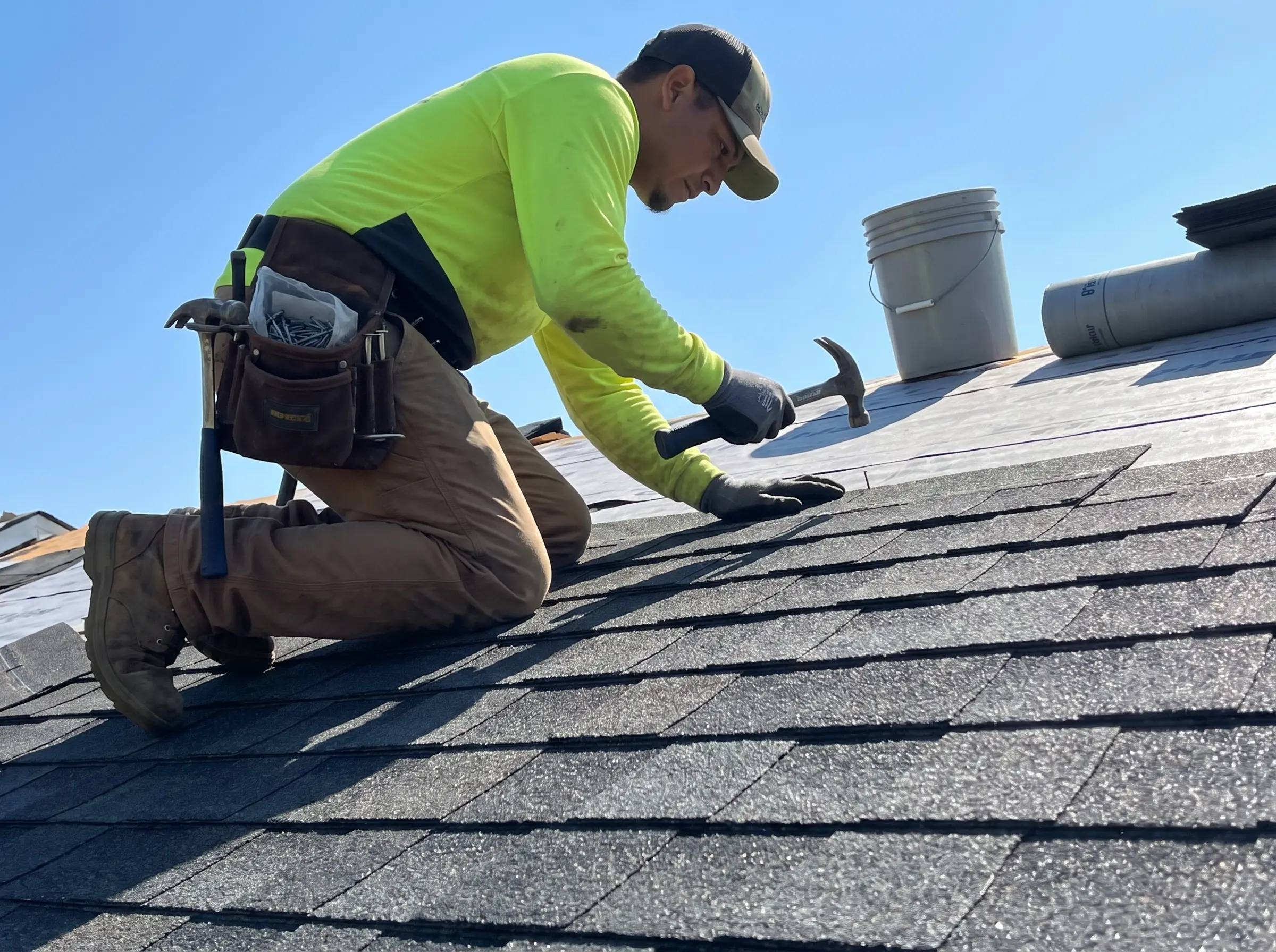 Roofing crew working on a residential roof