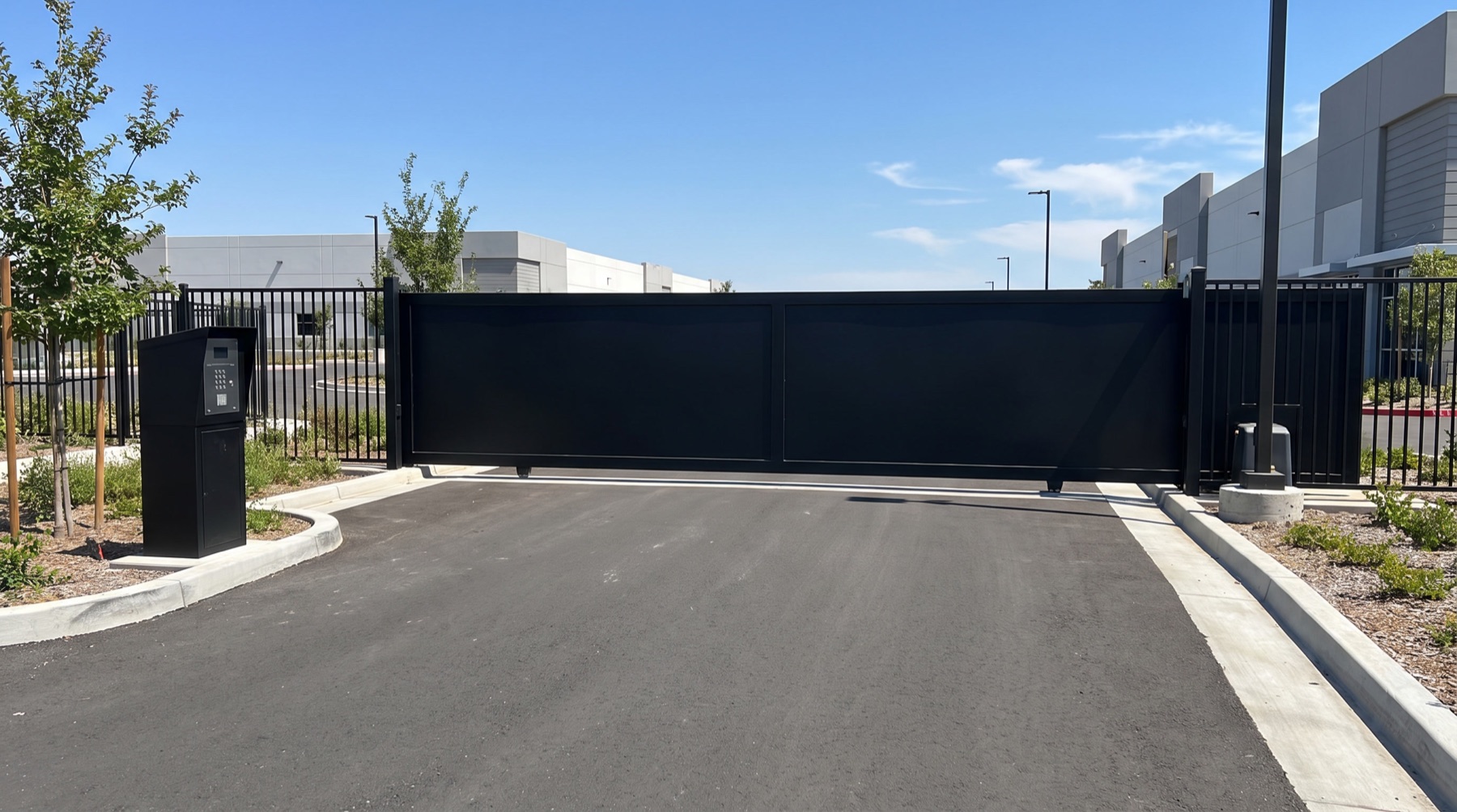 Black sliding gate at a commercial property