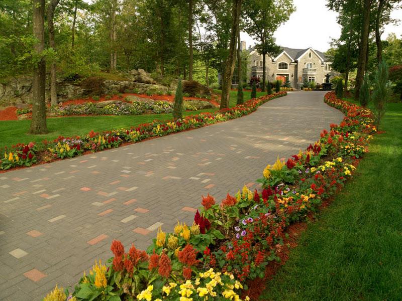 Paver driveway with flower beds