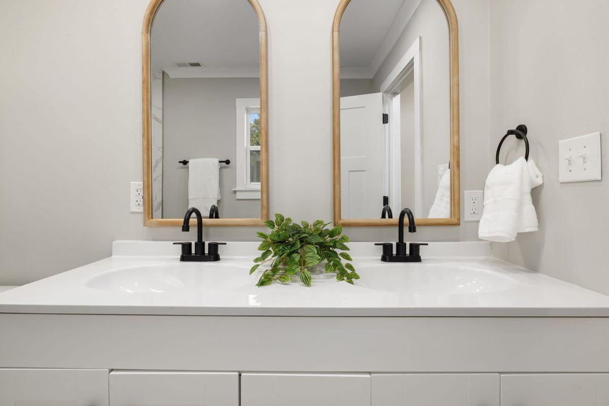 New bathroom vanity with a framed mirror