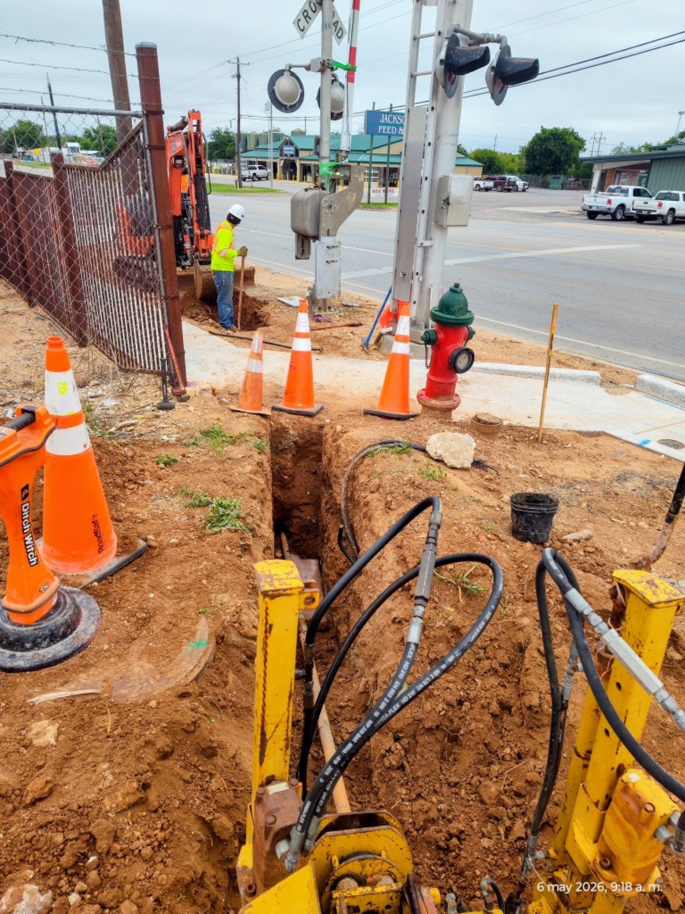 Bore trench alongside a railroad crossing signal