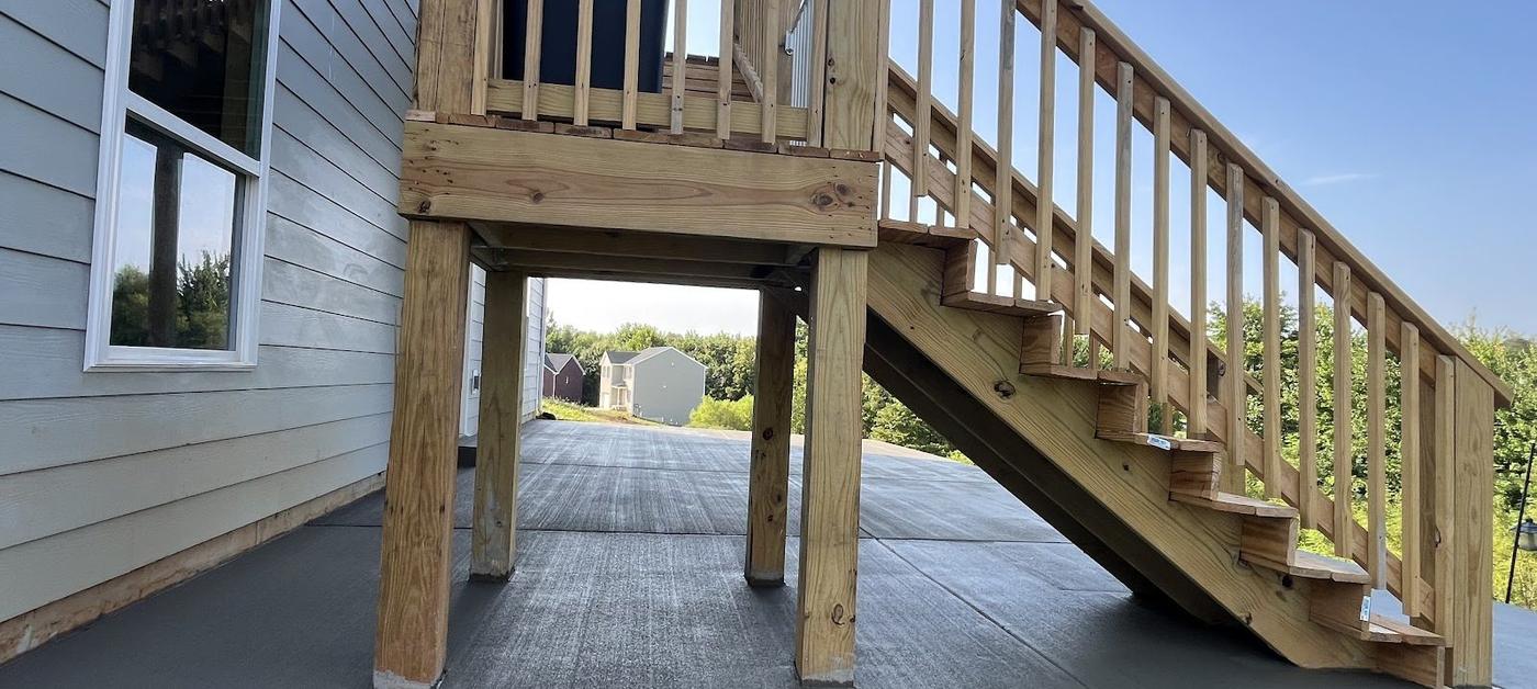 Deck and concrete project by Red War Contractors