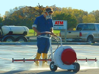 Applying protective treatment to a commercial parking lot