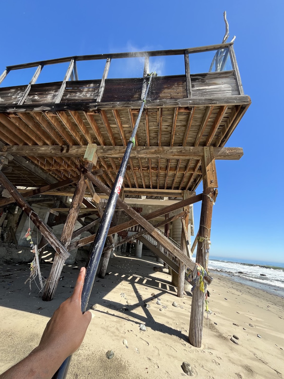 Pressure washing an oceanfront deck
