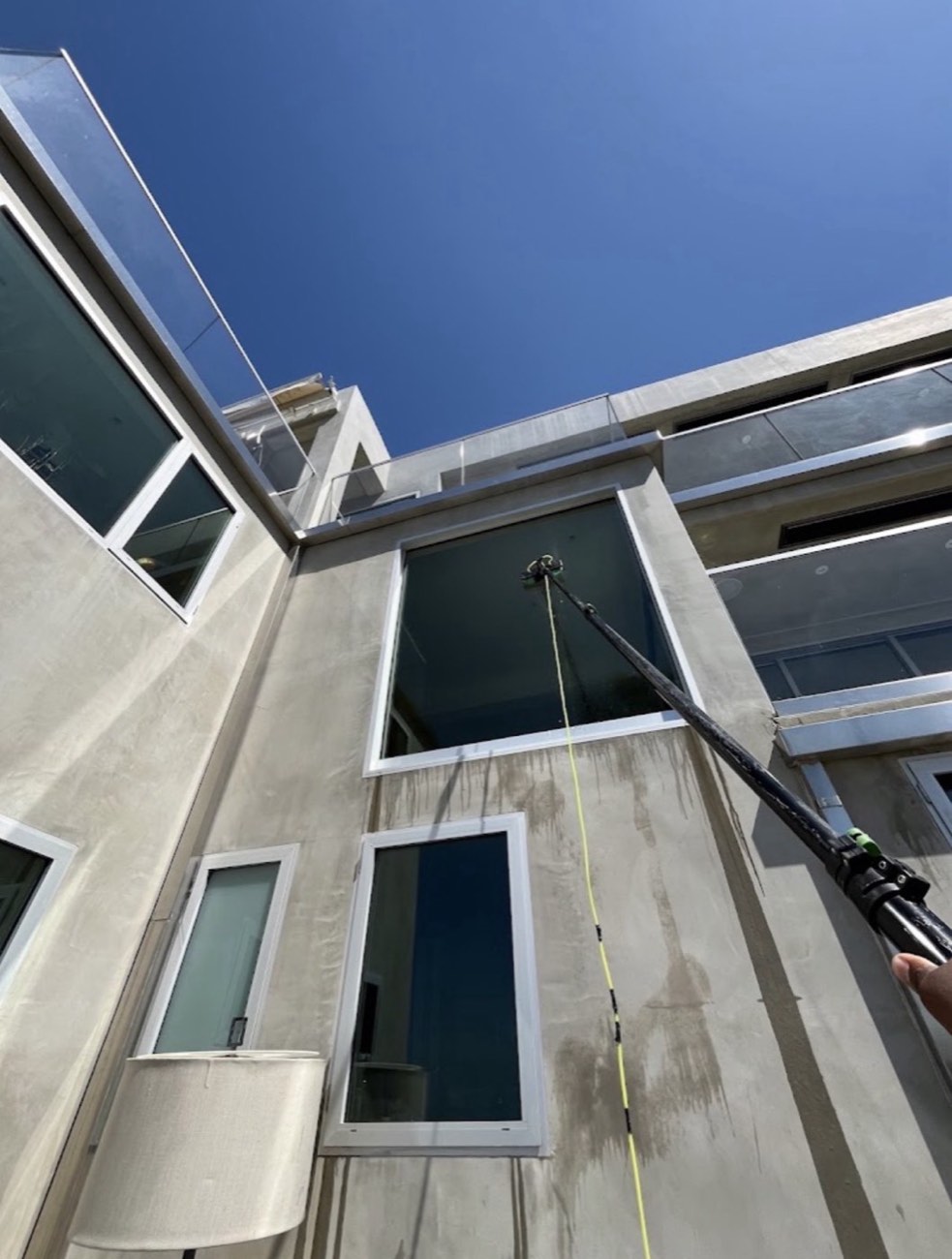 Window cleaning technician on the job