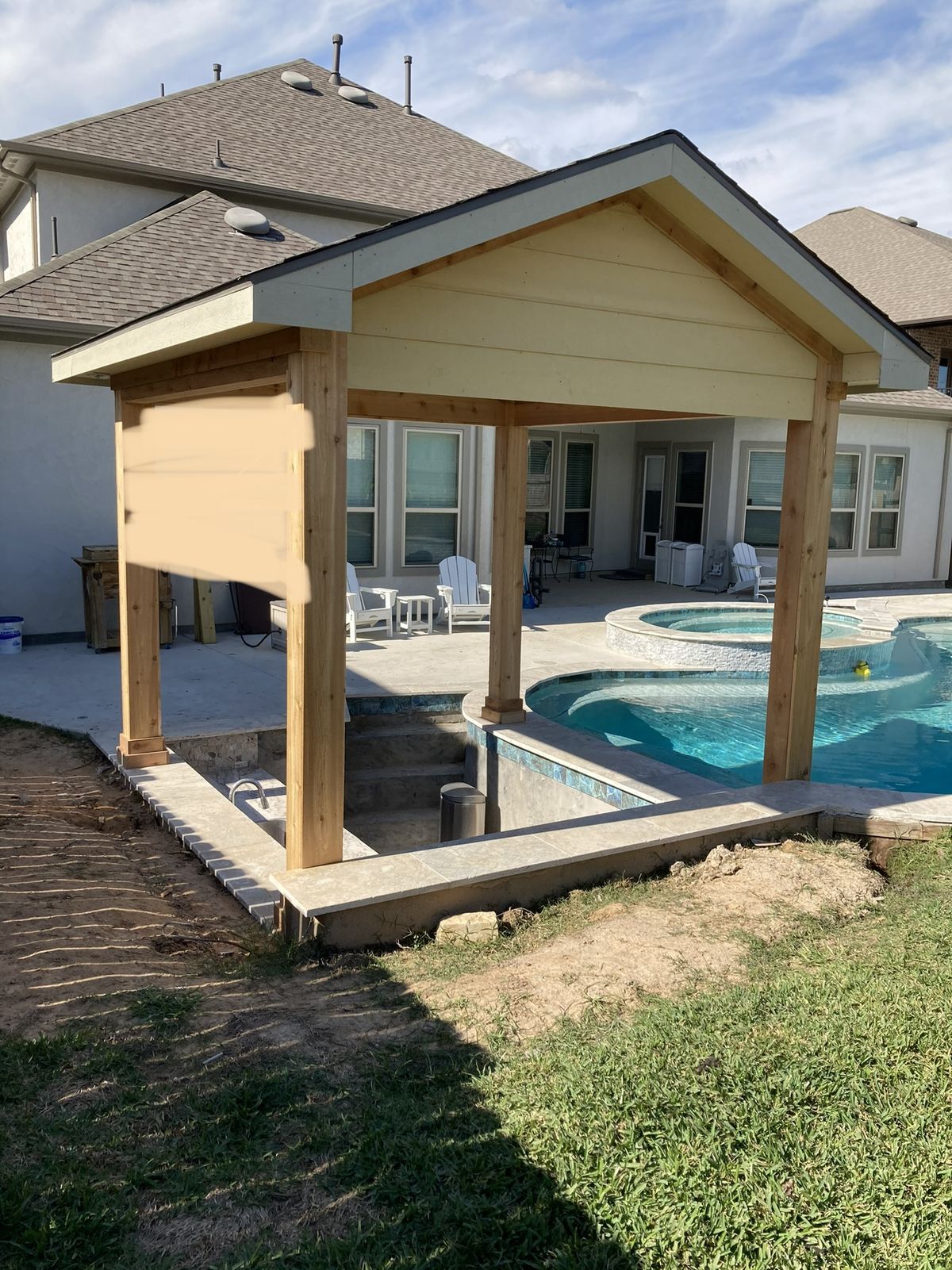 Cedar pergola going up over the swim-up bar