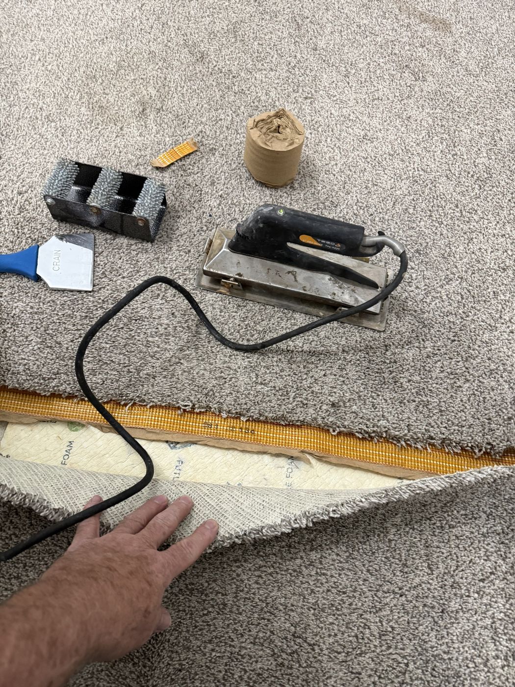 Carpet seam repair in progress