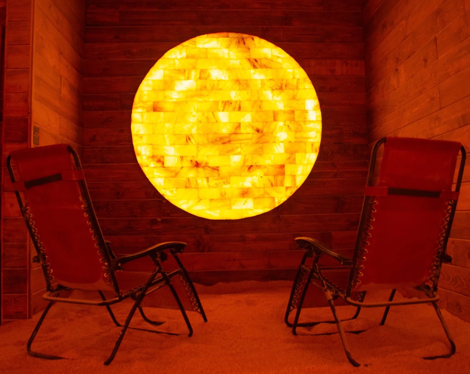 The Himalayan salt cave at The Healing Agenda, a glowing salt wall with zero-gravity recliners