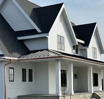 Seamless gutters and siding on a finished home