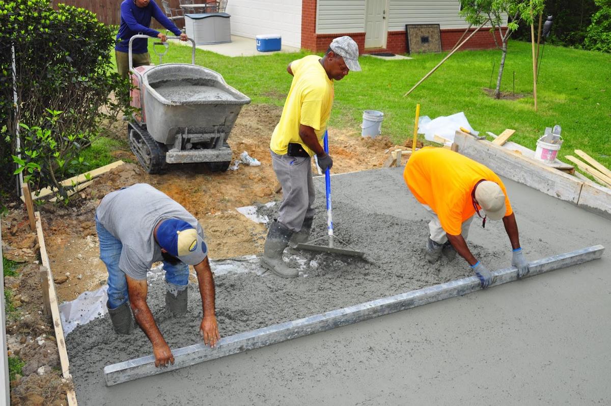 The Xtreme Concrete Company crew screeding and finishing a fresh pour